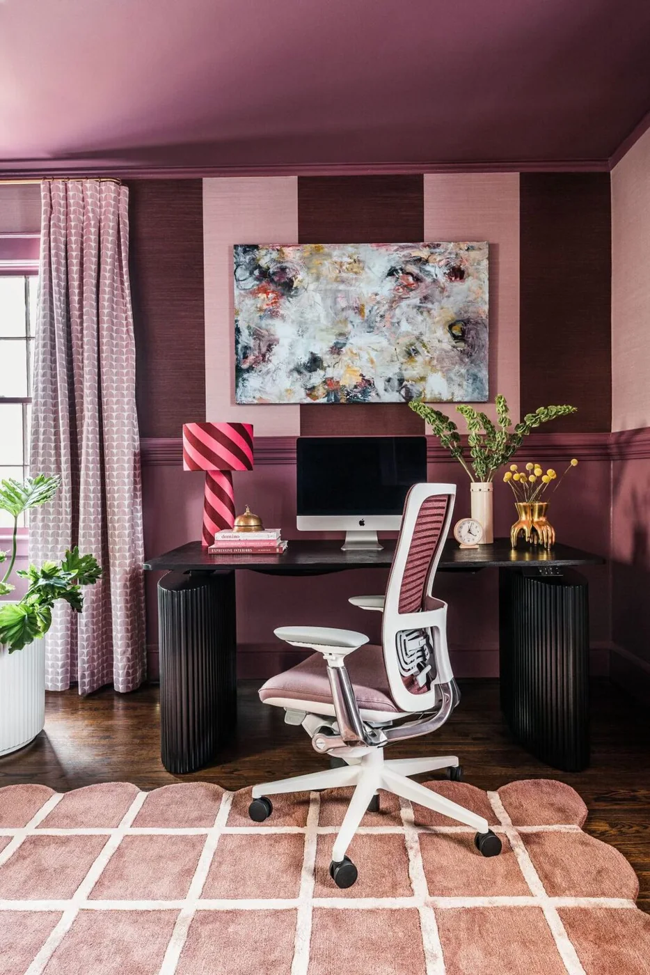 Plum home office with an original abstract canvas above the desk
