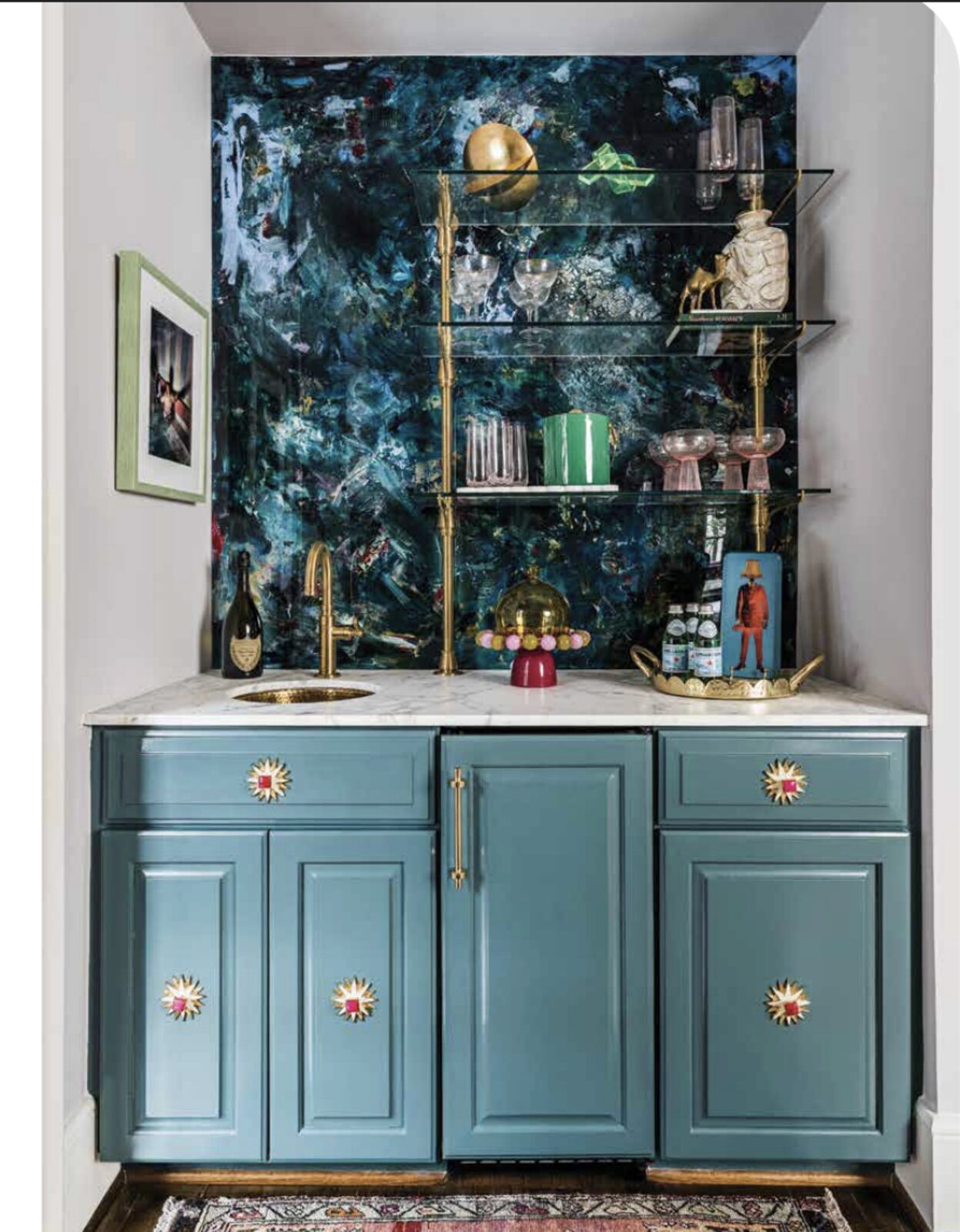 Blue bar cabinet with LUCiTE art back panel and brass shelving